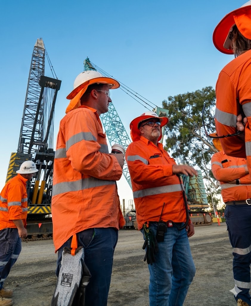 QBC team in workwear on site, working with pride and care - a workplace that attracts and retains skilled people
